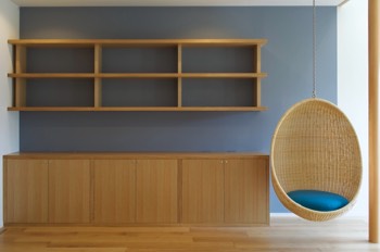  Bookshelves and storage furniture with hanging chair. 